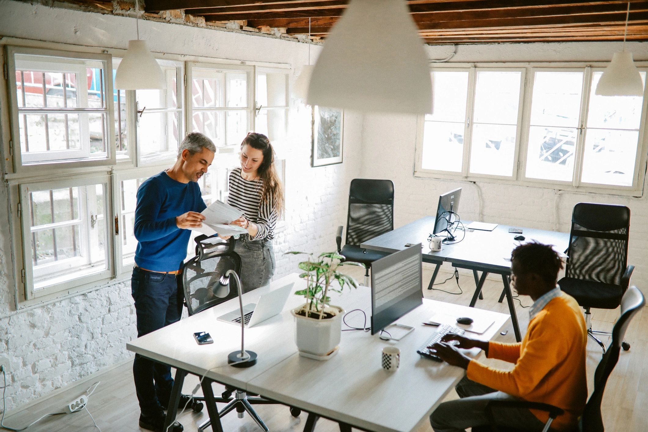 Technology professionals collaborating in an office