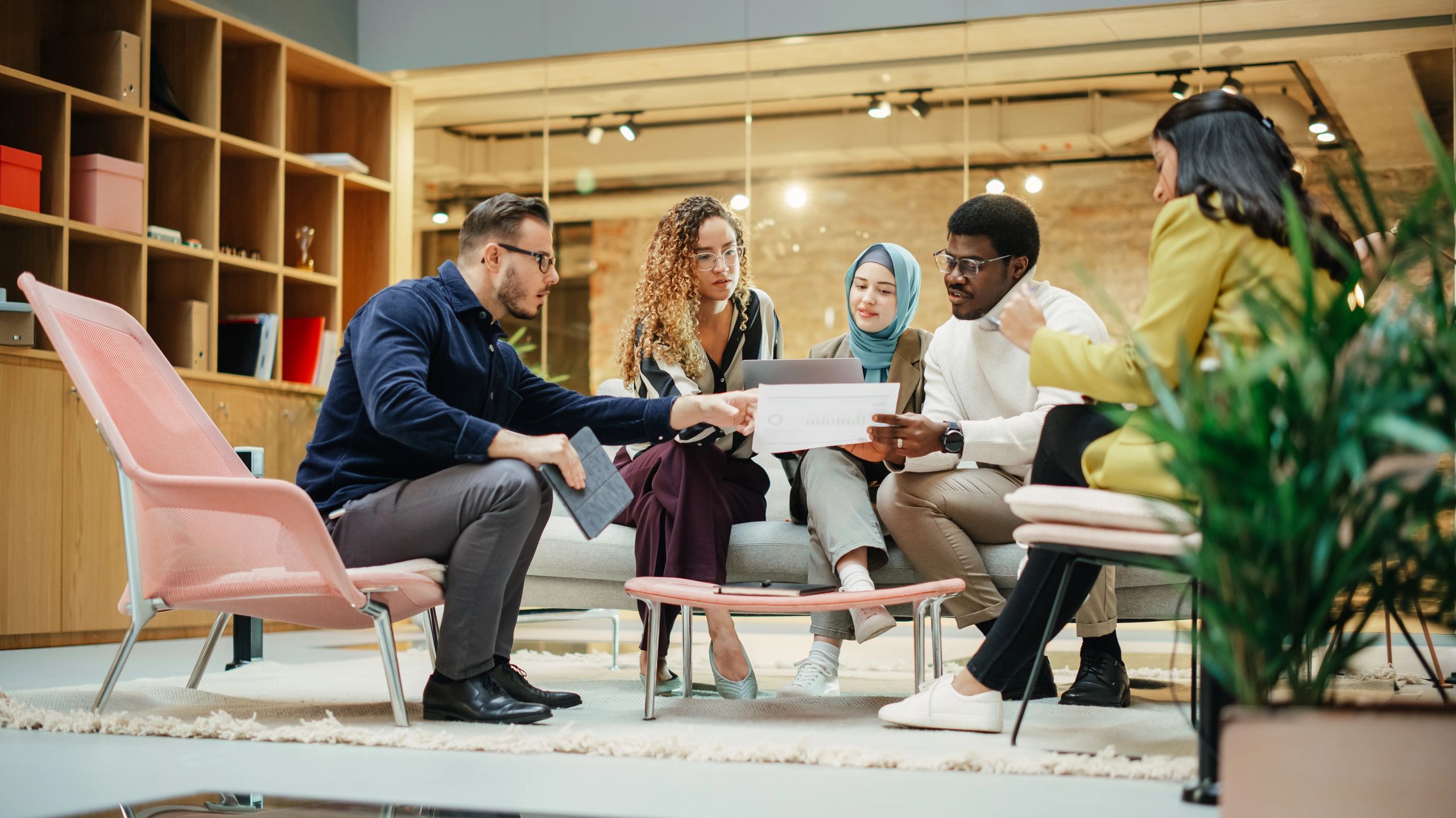 Multiethnic team preparing a presentation in a conference room