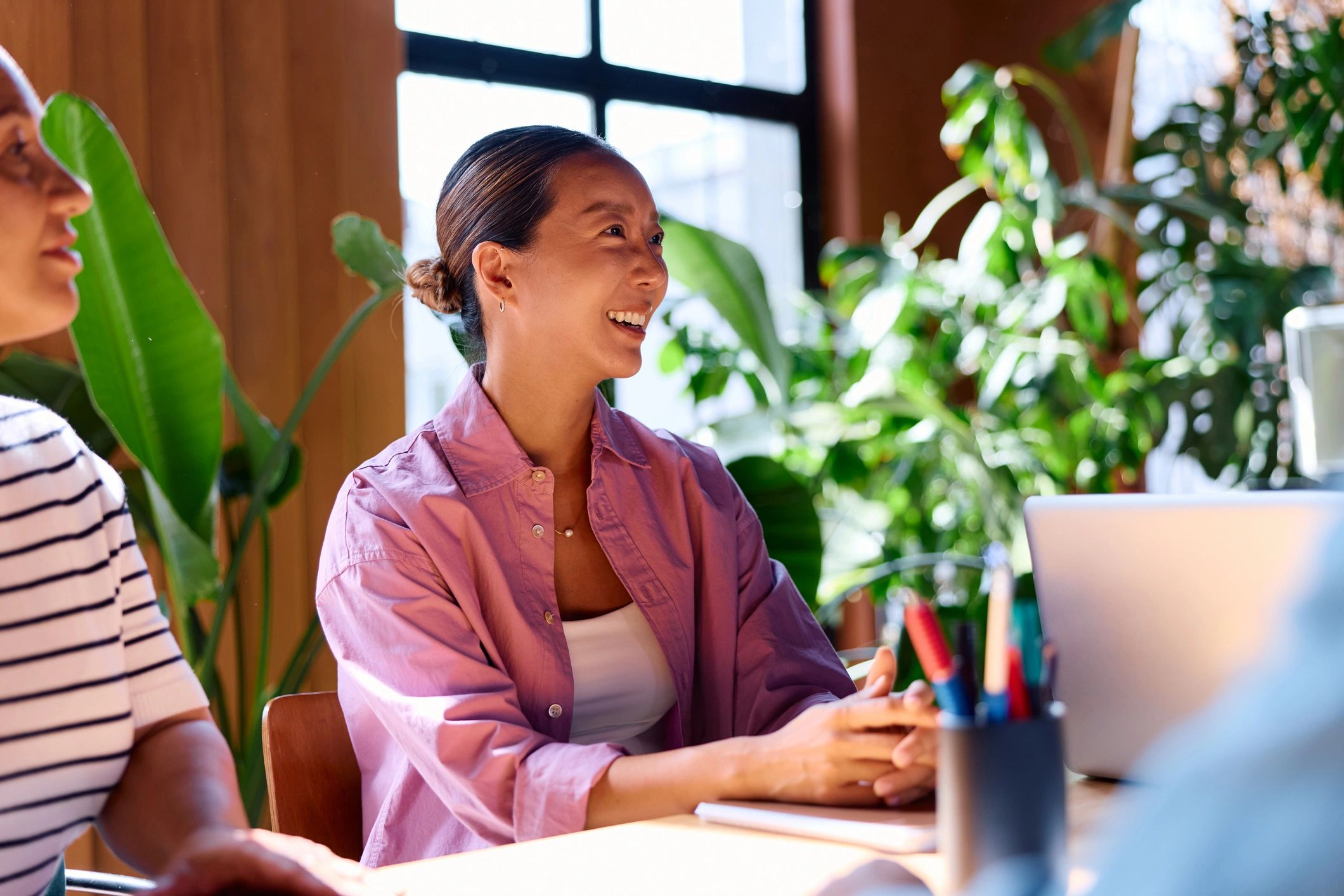 Entrepreneur collaborating with colleagues in a modern office