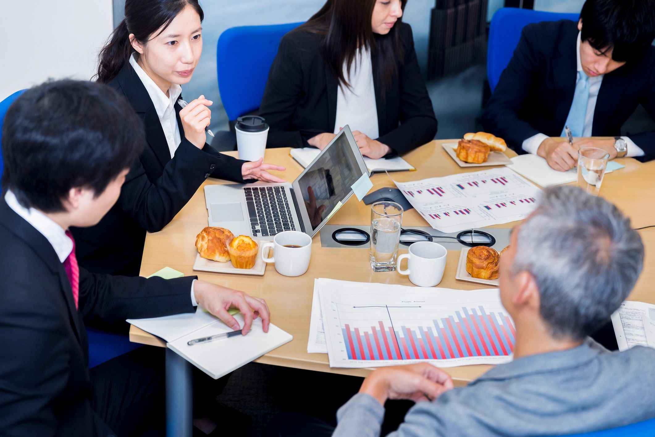 Multicultural business leaders in conversation